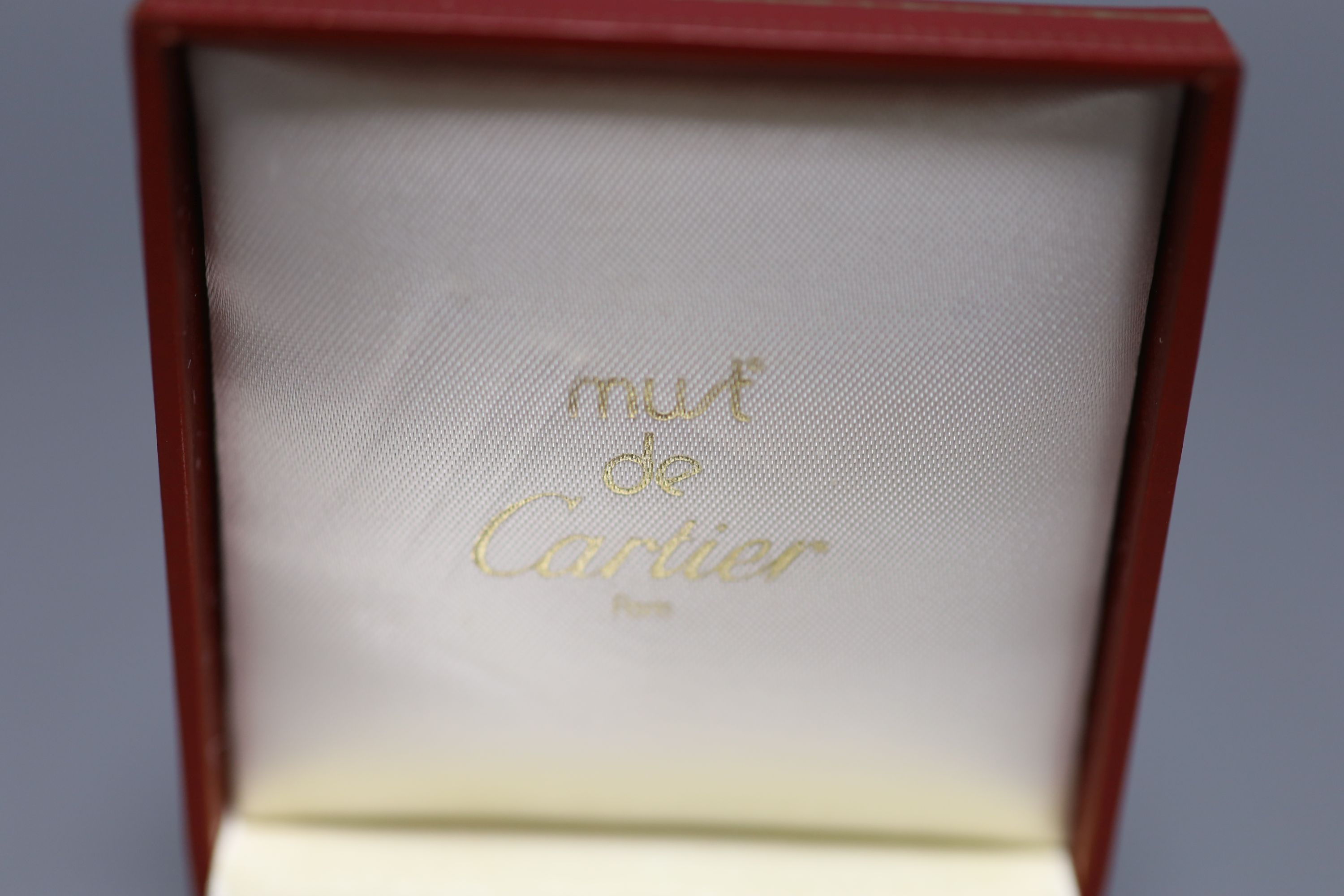 A steel and yellow metal Must de Cartier key fob, 52mm, with Cartier box.